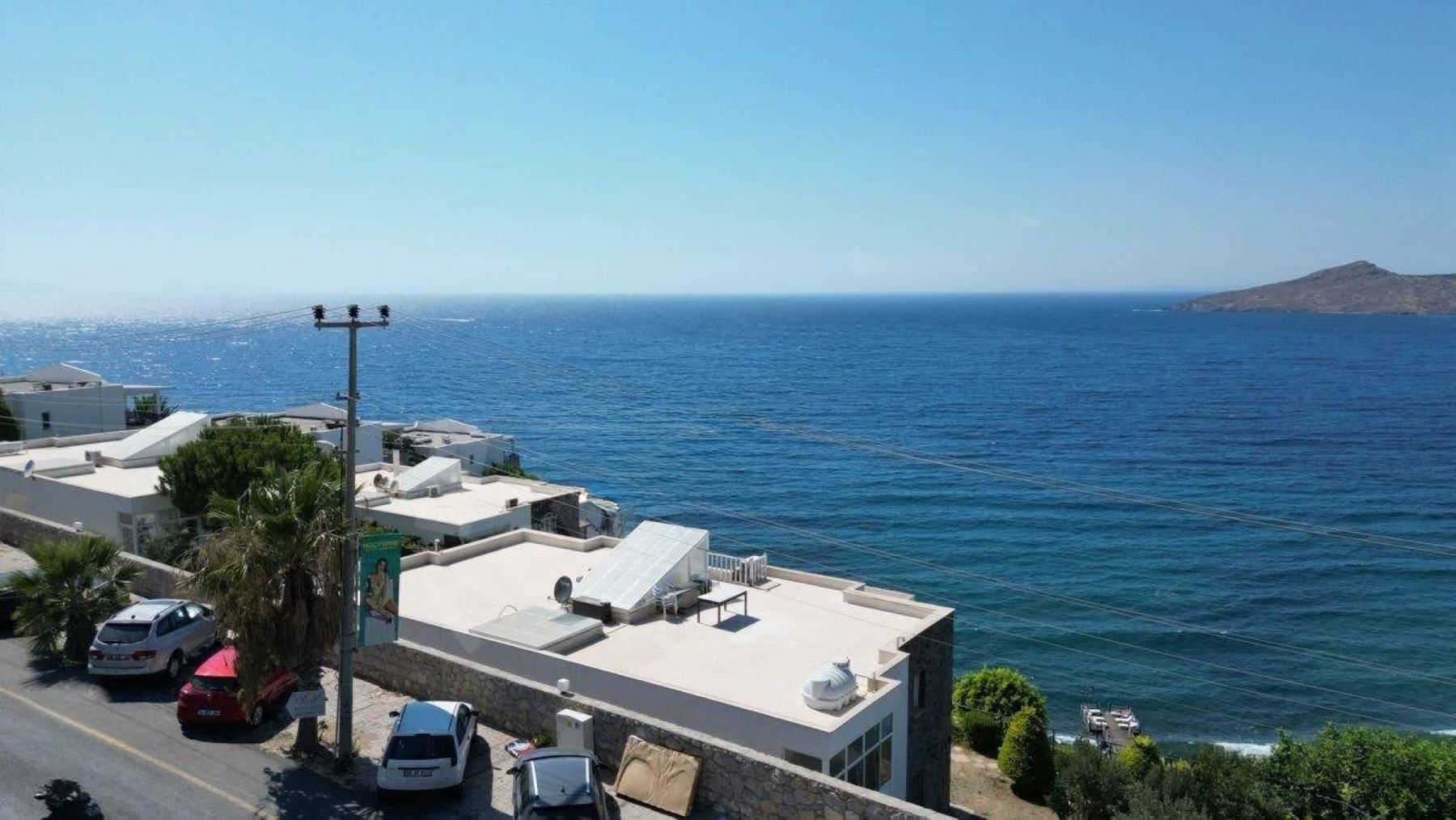 Seafront Apartment with Panoramic Sea and Islands View, Private Beach Access, and Located in a Secure Complex