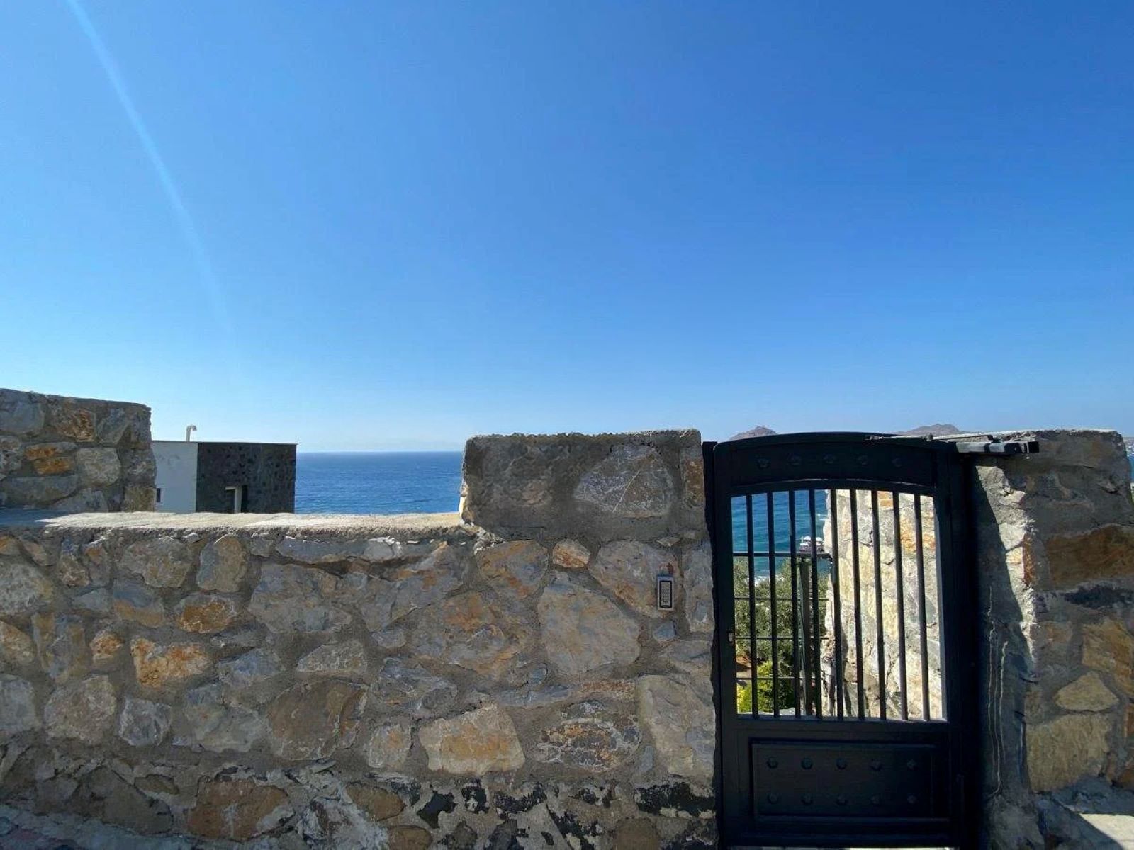 Seafront Apartment with Panoramic Sea and Islands View, Private Beach Access, and Located in a Secure Complex